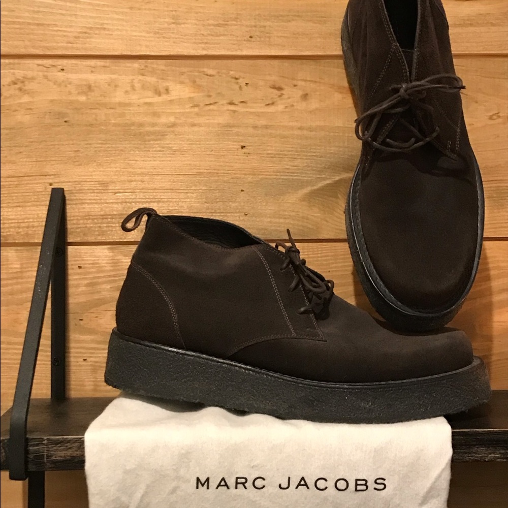 Dark brown suede chukkas.